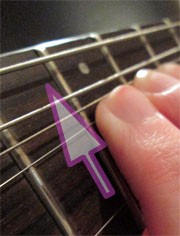 fingers bending strings