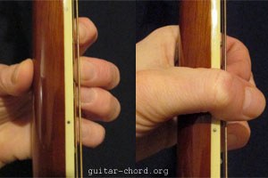 left hand holding guitar neck