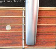 Capo pressing down strings
